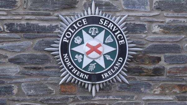 Man arrested over footage appearing to show shots being fired over a coffin