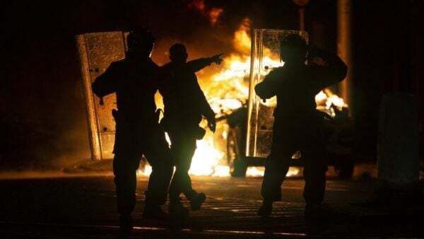 Protesters set Garda car on fire near scene of Dublin knife attack