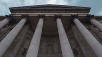 Pub doorman tells High Court that spinal injury was caused by drunk customers