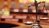 Brothers caught digging up €80,000 in coffee jars in a Dublin field