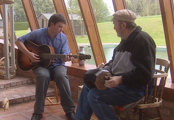 Father and son, Liam and Donal Clancy in conservatory at their home in Ring. Father and son, Liam and Donal Clancy in conservatory at their home in Ring.