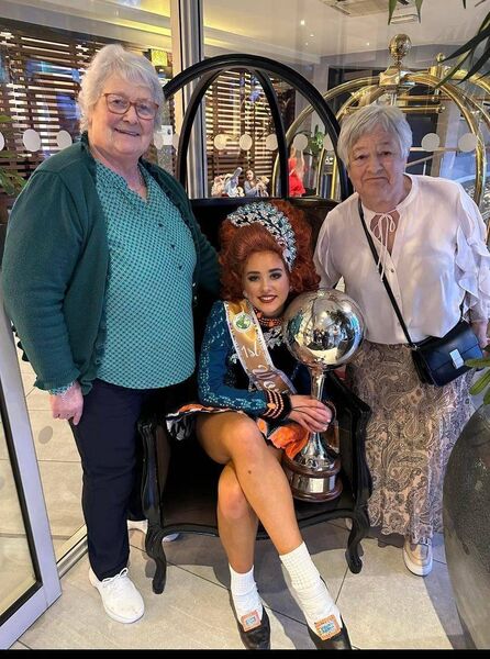 Annie Grant with her grandaunt and granny. She has previously placed 11th, 10th, 6th, and 5th last year in the run up to this year's first place victory.