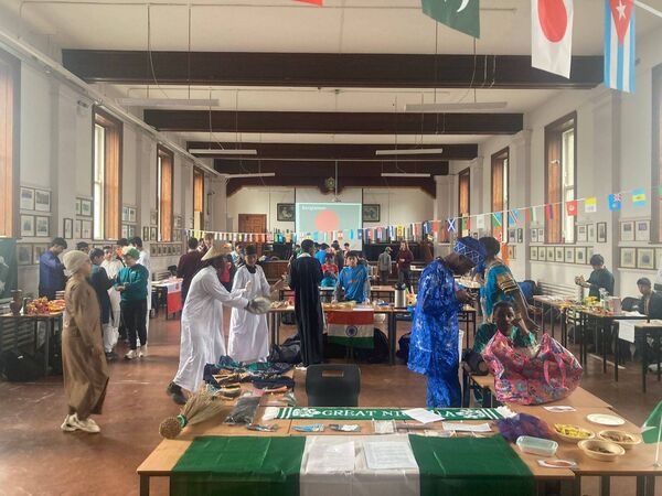Students at De La Salle College prepare for the school's inaugural Culture Day, where they showcased the culture and history of their heritage. Students from an abundance of cultural backgrounds took part in the event.