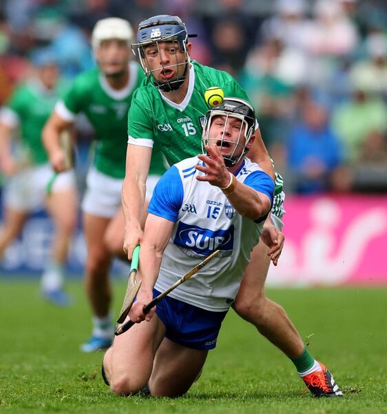 Waterford's Kevin Mahony under pressure from Limerick’s David Reidy in the Gaelic Grounds.