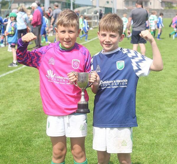 Ballinroad goalkeeper Damien Knopp and captain Luke Lacey with the U11F Sonny Nolan Cup at Graun Park.