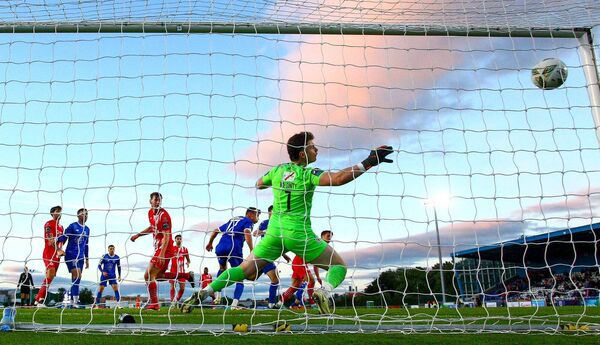 Waterford FC's Padraig Amond scores past Sligo Rover's Ed McGinty at the RSC.