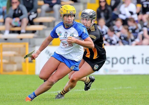 Waterford's Niamh Rockett turns away from Kilkenny's Clara Phelan.