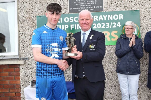 Waterford & District Junior League's John Foskin presents the Player of the Match Award to Hibernian's Ben Walshe. Waterford & District Junior League's John Foskin presents the Player of the Match Award to Hibernian's Ben Walshe.