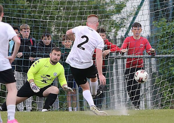 Tramore's Aran O'Brien sees his penalty shot go past Hibs goalkeeper Sean Whitty. Tramore's Aran O'Brien sees his penalty shot go past Hibs goalkeeper Sean Whitty.