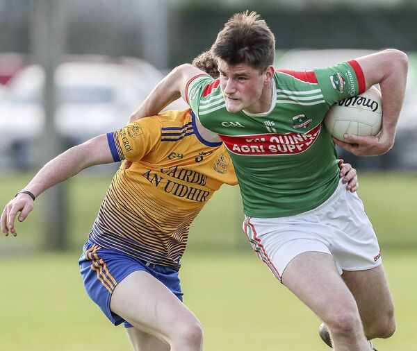 Rathgormack's Peter Walsh in action with Nire's Gerard Long.