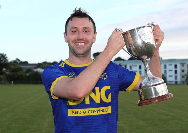 Dunmore East FC captain Ian Dunne with the Jimmy O'Neill Div.2 Cup.