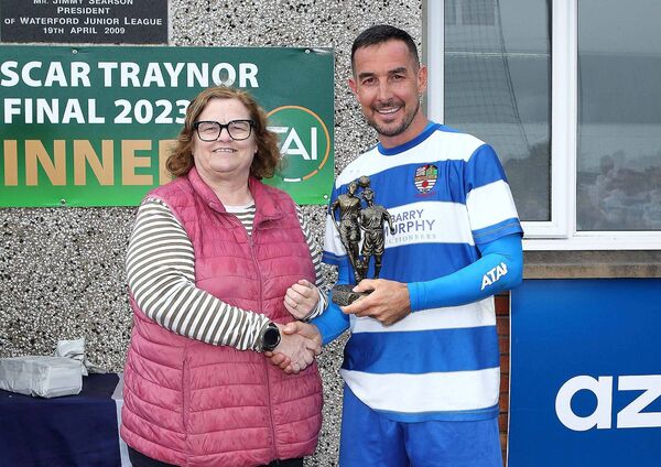 Louise Stafford presents the Man of the Match award to St. Joseph’s Paul Butler.