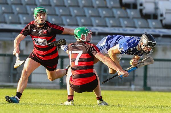 Mount Sion's Tommy McGrath is fouled by Ballygunner's Darragh O'Keeffe Mount Sion's Tommy McGrath is fouled by Ballygunner's Darragh O'Keeffe