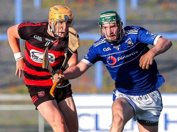 Mount Sion's Ben Frisby is tackled by Ballygunner's Peter Hogan Mount Sion's Ben Frisby is tackled by Ballygunner's Peter Hogan