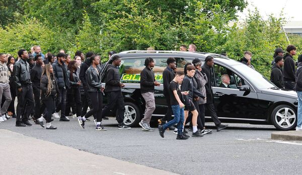 The funeral cortege for 15-year-old Gilbert Collins arriving at Kilbarry Cemetery.