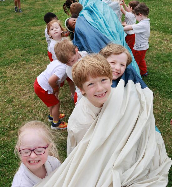 Helping to pack away the Hot Air Balloon, at Park Montessori Annual Art Exhibition in aid of Juniors for Juniors. Photo: Joe Evans