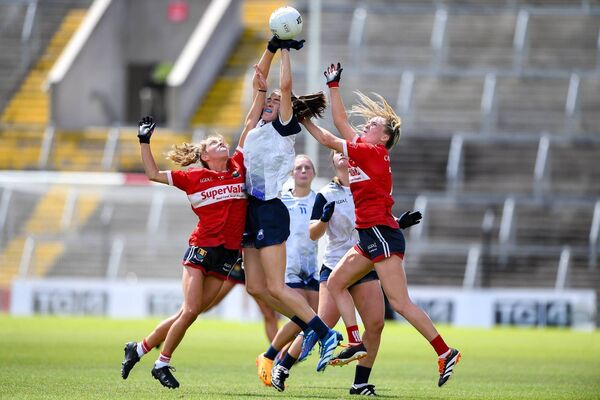 The outstanding Emma Murray of Waterford in action against Rachel Leahy and Daire Kiely of Cork.