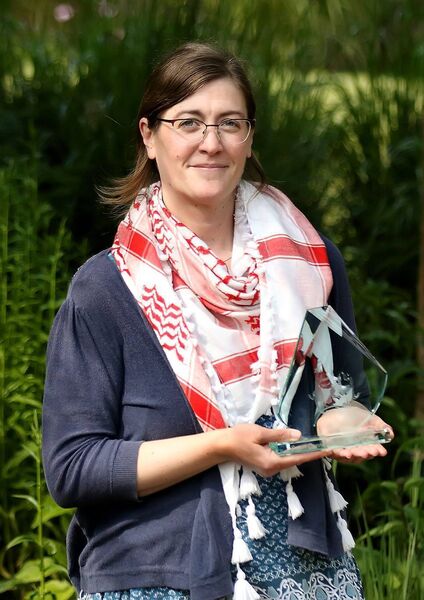 The winner of the Sean Dunne Poetry competition Giada Gelli is pictured with her prize, a lovely etched drawing on glass of the late Sean Dunne. 