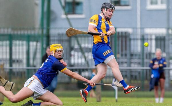 Erins Own's Eoin Daly scores their first goal against Butlerstown under pressure from Oliver McAlister