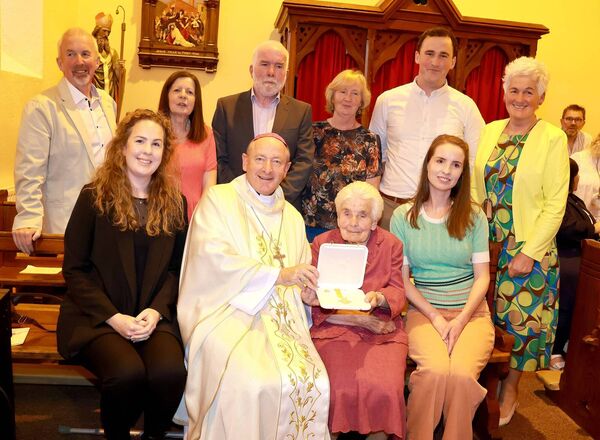 Bishop Alphonsus Cullinan presented Mary Power with the Papal award the Benemerenti Medal at a Mass of Thanksgiving, at the sacred Heart Church, Dunhill in recognition of Mary's 48 years service to the church. Photo: Joe Evans