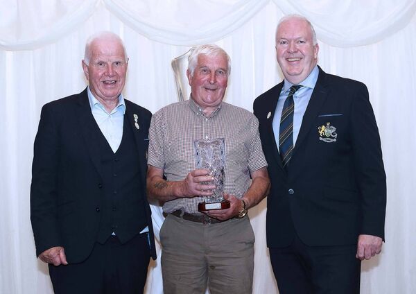 Paddy Kirk, Ballyduff FC is pictured receiving his Special Recognition Award from Waterford &amp; District Junior League Chairman Damien Tiernan and John Foskin, President, WDJL. Photos: Noel Browne.