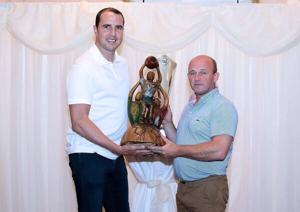 John O'Shea was presented with a specially commissioned award carved by John Hayes from the Waterford &amp; District Junior League to mark his achievements in both his club football career at Manchester United and his Irish International career and woodcarver John Hayes was on hand to make the presentation to him.