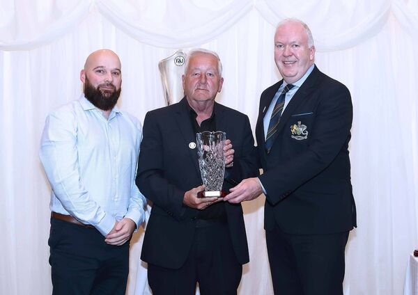 Michael Lynch, Ferrybank FC is pictured receiving his Special Recognition Award from Waterford &amp; District Junior League Chairman Damien Tiernan and Paddy Byrne, Treasurer, WDJL.