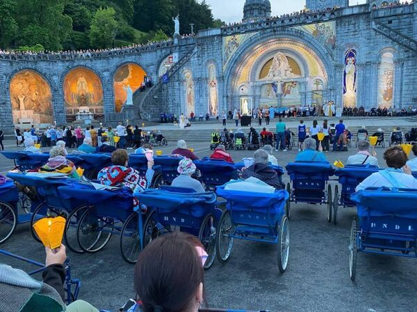 Some of the Waterford malades enjoying the Torchlight Procession in Lourdes in front of the Rosary Basilica during this year's Pilgrimage