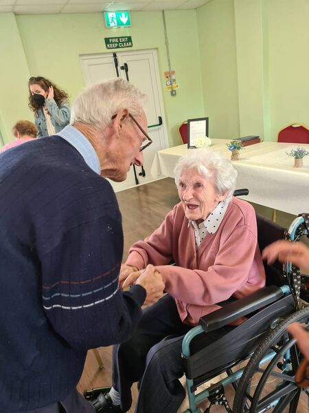 Teresa is congratulated on her 100th birthday celebration