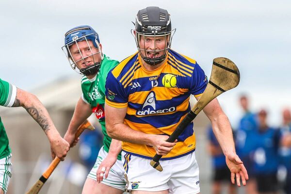 Abbeyside's Daire Slevin gets away from Ferrybank's John Ahern