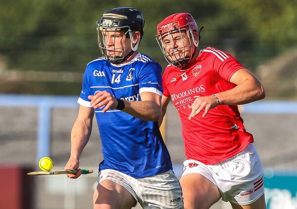 Mount Sion's Jamie Gleeson gets away from Passage's Thomas Carey