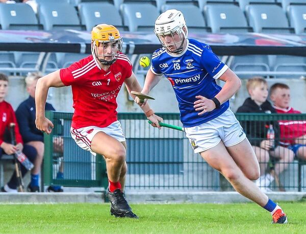 Mount Sion's Adam Regan gets away from Passage's Kevin Cullinane