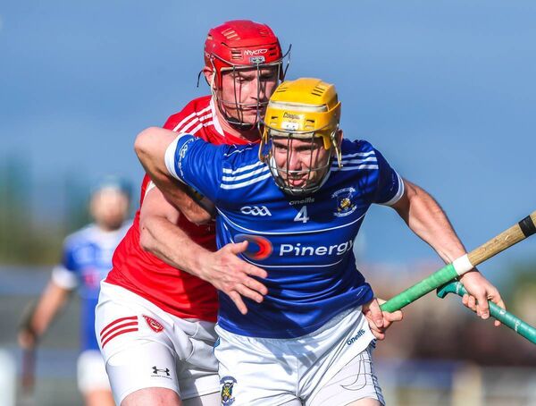 Mount Sion's Martin F O'Neill is tackled by Passage's Liam Flynn