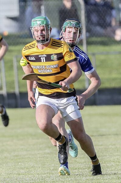  Lismore's Jack Prendergast on a solo run ahead of Dungarvan's Jack Lacey.