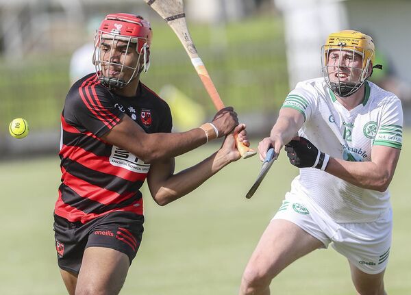 Ballygunner's Conor Tobin gets in his stroke ahead of Shamrock's Edward Lonergan during their J.J.Kavanagh &amp; Sons Waterford Premier Intermediate hurling match in the Fraher Field. Photos: Sean Byrne