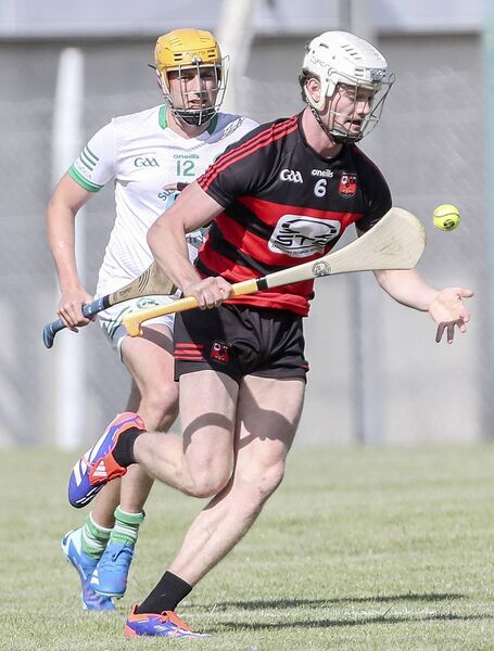 Ballygunner's Tom Gallagher in possession ahead of Shamrock's Edward Lonergan.