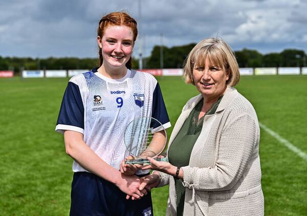 Waterford's Hannah McGrath of Waterford receives the Player of the Match award from LGFA chairperson Geraldine Giles.