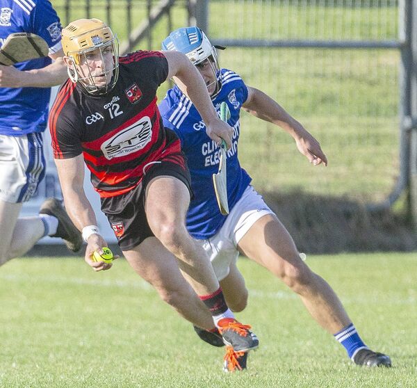 Ballygunner's Peter Hogan in full flight ahead of Dungarvan's Mikey Burke. Ballygunner's Peter Hogan in full flight ahead of Dungarvan's Mikey Burke.