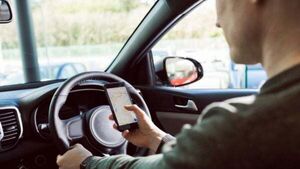 Total of 40% of young drivers admit to checking their phones while driving
