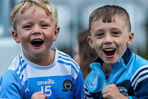 Jack O'Neill and Cory Barrett supporting Roanmore in Walsh Park.