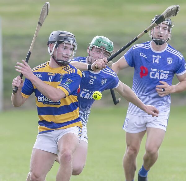 Abbeyside's Rian Walsh in action with Fourmilewater's Tom Barron during their Co. SHC tie in Fraher Field. Photos: Sean Byrne.