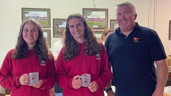 Niamh Lynch and Grace Kelliher of Waterford Harbour Sailing Club receiving their second place award in the Leinster 420 Class Silver Fleet Championships from Donie Herraghty, Lough Ree Yacht Club.
