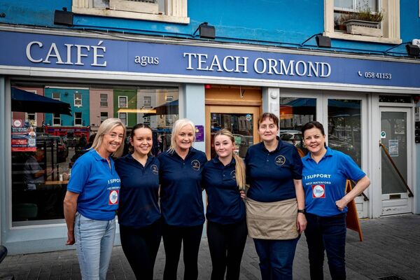 Jenny, manager of An Teach Ormond Dungarvan and her team with Head of Communications of the Rapid Response Vehicle Fundraising Committee Phil Donnelly and Fundraising Volunteer Karen Walsh.