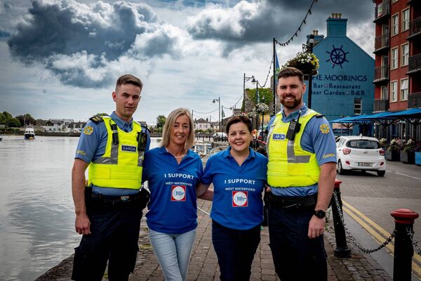 Garda Aaron and Garda Niall, from the Dungarvan Garda Unit, with Phil and Karen