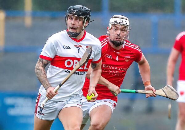 De La Salle's Lorcan Dwyer gets away from Passage's Callum O'Neill. De La Salle's Lorcan Dwyer gets away from Passage's Callum O'Neill.