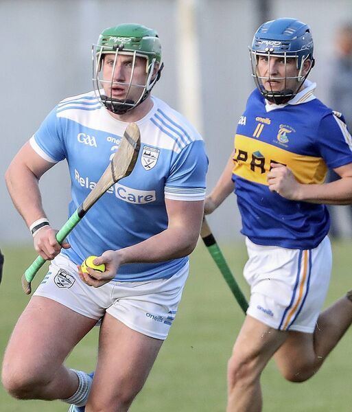 Roanmore's Billy Nolan in possession ahead of Tallow's Daragh Buckley. 