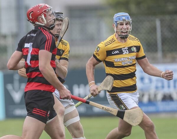 Lismore's Ben O'Sullivan scores the first of his three goals against Ballygunner's Ronan Power much to the delight of Maurice Shanahan.