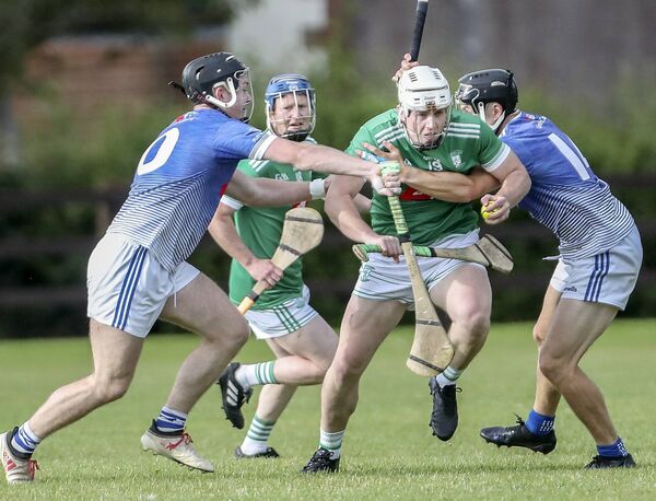 Ferrybank's Cormac Heffernan is tackled by Fourmilewater's Michael Morrissey and Jamie Barron during their Co. SHC tie at Dungarvan GAA Grounds. Photos: Sean Byrne.