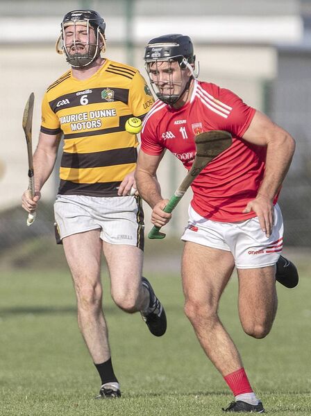 Passage's Mark Fitzgerald gets away from Lismore's Ray Barry. 