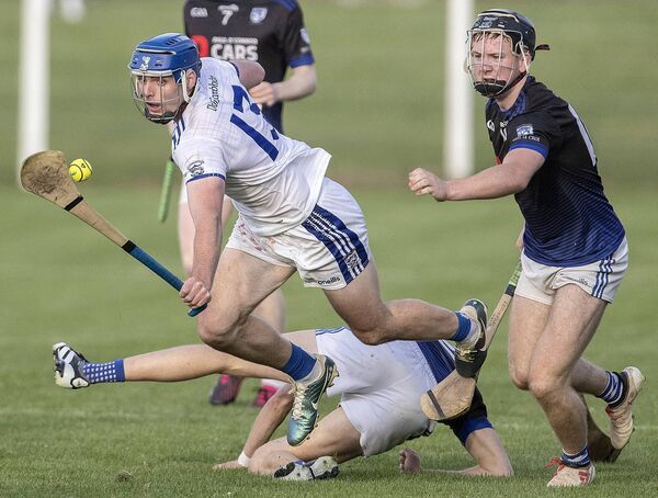 Dungarvan's Sean Crotty in action ahead of Fourmilewater's Michael Morrissey during their Preliminary Quarter Final of the Waterford SHC in Fraher Field. Photos: Sean Byrne.